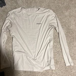 White Patagonia with colorful fish hook on back